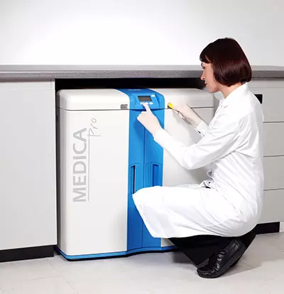 Woman programming  a Medica unit